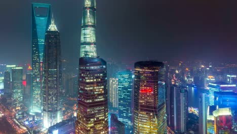 Time-lapse-of-Shanghai's-three-tallest-skyscrapers,-the-Shanghai-World-Financial-Center,-the-Jin-Mao-Tower,-and-the-Shanghai-Tower-at-sunset