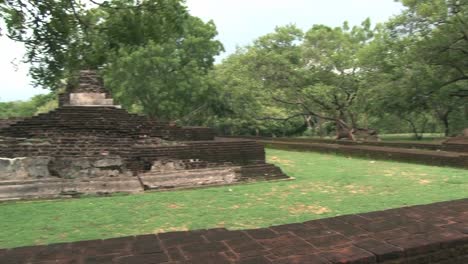 View-to-the-ruins-of-the-ancient-city-and-trees-in-Polonnaruwa,-Sri-Lanka.