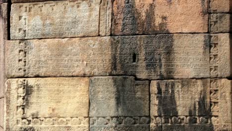 Stone-carving-with-a-text-at-the-ruins-in-Polonnaruwa,-Sri-Lanka.