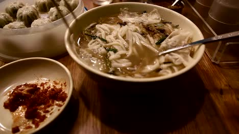 Upclose-shot-of-Korean-dumplings-and-noodle-dish