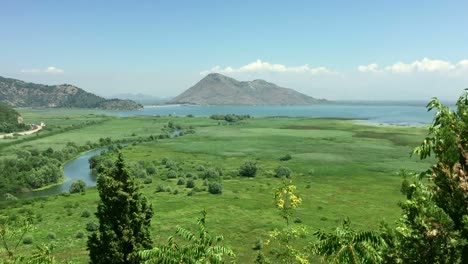 Beautifull-landscape-tranquil-scenery-with-green-valley-blue-sky-and-white-clouds.-Tilting-shot.-Super-background-with-nature-landscape-view.-Paradise.