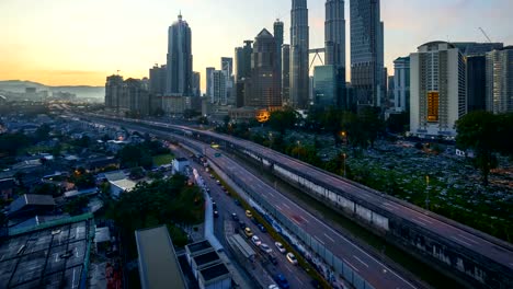 dramatic-sunrise-at-Kuala-Lumpur-city-with-sun-burst-ray.-Moving-and-changing-color-clouds.