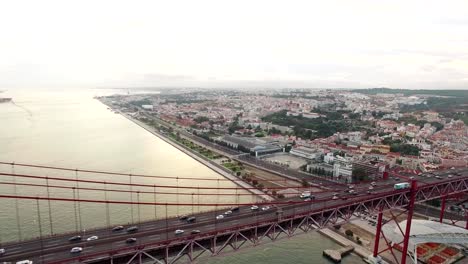 Cars,-trains,-bus-on-25-April-bridge-in-Lisbon-aerial-view