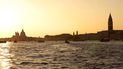 Evening-in-Venice.-Majestic-grand-canal-in-Venice,-and-water-traffic,Venice,-Italy.-Venice-is-a-city-in-northeastern-Italy-and-the-capital-of-the-Veneto-region.