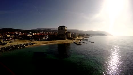 Phospfori-tower-in-Ouranopolis,-Athos-Peninsula,-Mount-Athos,-Chalkidiki,-Greece-at-sunset