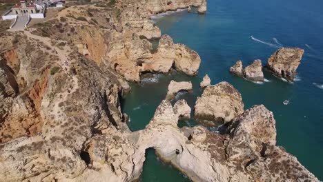 Aerial-view-of-Ponta-da-Piedade-rock-formations-in-Lagos,-Portugal