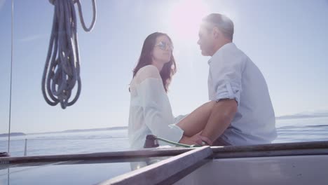 Young-couple-on-sailboat-together.