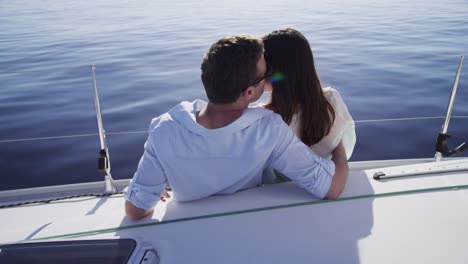 Young-couple-on-sailboat-together.