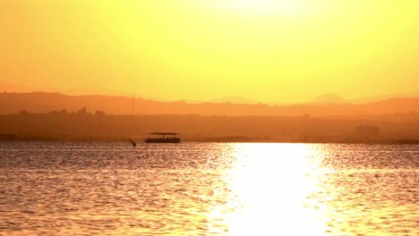 Tourists-in-a-boat-in-Albufera,-Valencia.-They-come-back-to-visit-the-natural-landscape