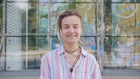 Young-Lady-with-Modern-Hairstyle-Smiling-Outdoors