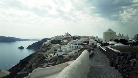 gimbal-shot-approaching-the-village-of-oia,-santorini