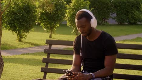 Slow-Motion-Portrait-of-mature-african-american-man-in-city-listening-to-music-real-people.