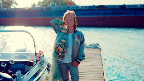 Girl-with-fishing-nets-on-the-dock