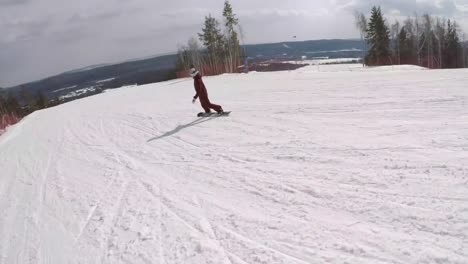 Follow-Shot-of-a-Female-Snowboarder