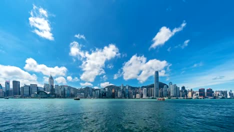 Hong-Kong-Panorama-Zeitraffer.-Innenstadt-und-den-Victoria-Harbour.-Bankenviertel-in-smart-City.-Wolkenkratzer-und-Hochhaus-Gebäude.-Panoramablick-am-Mittag.