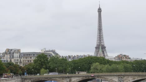 Parisian-and-French-famous-Eiffel-tower-near-river-Seine-by-the-day-slow-tilt-4K