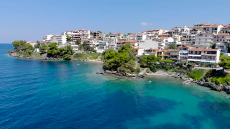 Drone-aerial-view-over-blue-sea-water-on-coast-of-Neos-Marmaras