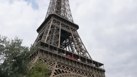 Monument-Eiffel-tower-in-Paris-France-by-the-day-in-front-of-sky-and-clouds-4K-2160p-30fps-UHD-footage---Beautiful-and-recognizable-Eiffel-tower-4K-3840X2160-UltraHD-video