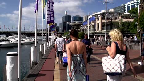 Pan-from-boats-to-people-walking-at-Darling-harbour
