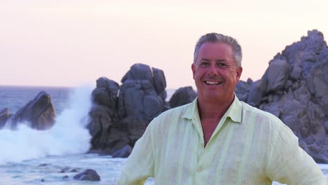 Portait-of-an-older-man-standing-on-the-beach