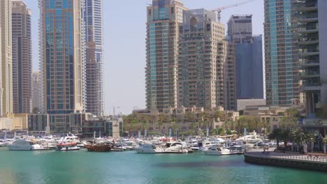 uae-dubai-marina-sun-light-walking-bay-yacht-dock-view-4k