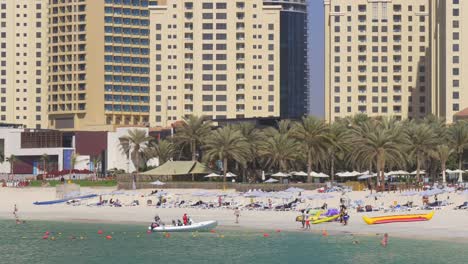 uae-summer-time-dubai-marina--jbr-crowded-beach-4k