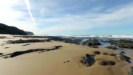 Rocks-and-ocean-at-Praia-Vale-Figueiras-in-Portugal