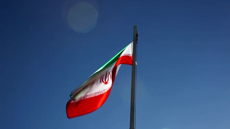 National-flag-of-Iran-on-a-flagpole