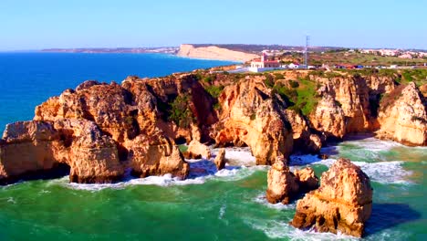 Aerial-from-rocks-and-ocean-at-Ponte-de-Piedade-in-Lagos-Portugal