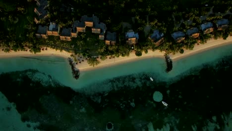 Aerial-shot-of-island-oceanfront-with-villas,-Mauritius