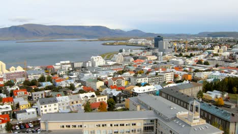 top-view-on-panorama-of-Reykjavik-city-and-coast-of-Atlantic-ocean,-mountain-Esja,-island-Videy