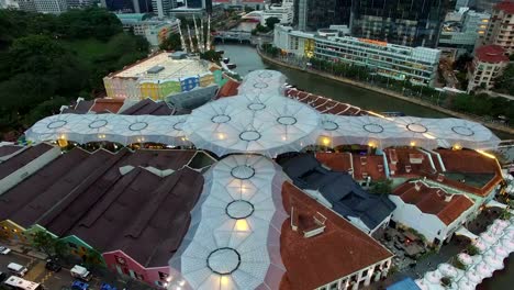 low-to-rising-aerial-over-clark-quay-at-night