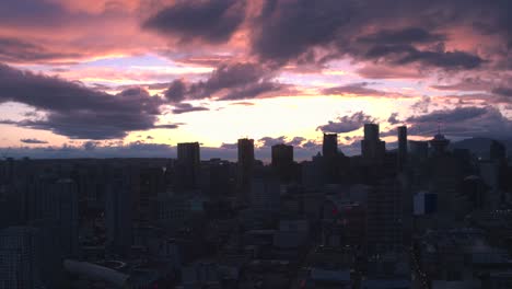 Aerial-View-flying-over-downtown-Vancouver-at-sunset