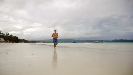 Man-running-on-the-beach