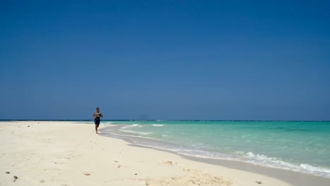 Man-running-on-the-beach