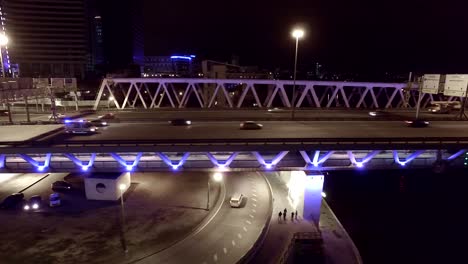 Aerial-night-highway-bridge-passing-cars