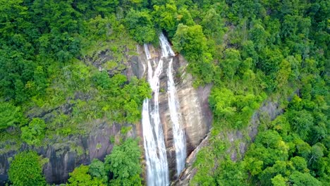 Close-approach-to-waterfall-aerial-view-from-drone-in-rain-forest,-Siriphum-waterfall-in-Chiangmai,-Thailand.