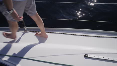 Young-couple-walking-on-sailboat-together.