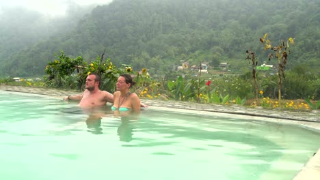 A-man-and-a-woman-relaxing-in-a-hot-spring