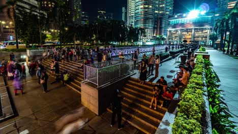 KUALA-LUMPUR,-MALAYSIA---May-15,-2018:-Fountain-at-night-with-peoples-near-Petronas-twin-tower-4K