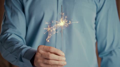 Footage-businessman-holding-sparkler-and-celebrating-new-year-or-success-business