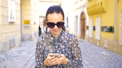 Woman-walking-in-city.-Young-attractive-tourist-outdoors-in-european-city