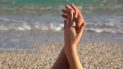 Gentle-touch,-lovers-hands-playing,-finger-touch,-close-up,-beach,-sea-waving