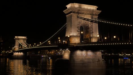 Panning-on-Chain-Szechenyi-Bridge-by-night-in-Budapest-Hungary-and-Danube