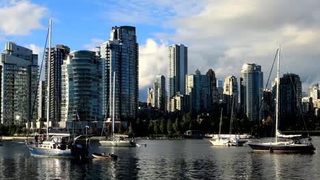 Timelapse-of-Vancouver,-Canada-with-boats-in-foreground