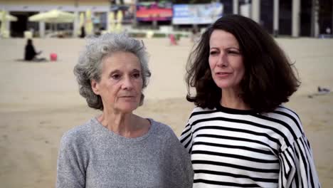 Smiling-women-looking-at-something-and-pointing.