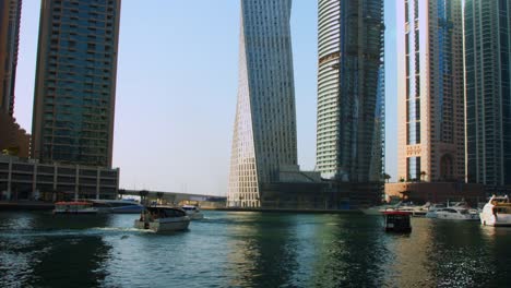 Locked-On-shot-of-a-ferry-boat-moving-on-river,-Dubai,-United-Arab-Emirates