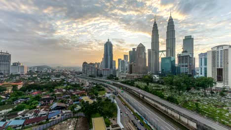 4k-time-lapse-of-dramatic-sunrise-at-Kuala-Lumpur-city.-Moving-and-changing-color-clouds.-Aerial-view.