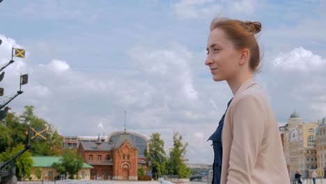 Young-woman-looking-at-historical-part-of-city