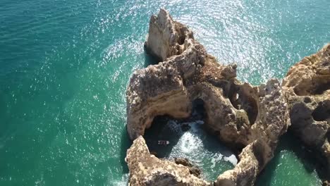 Aerial-view-of-Ponta-da-Piedade-rock-formations-in-Lagos,-Portugal